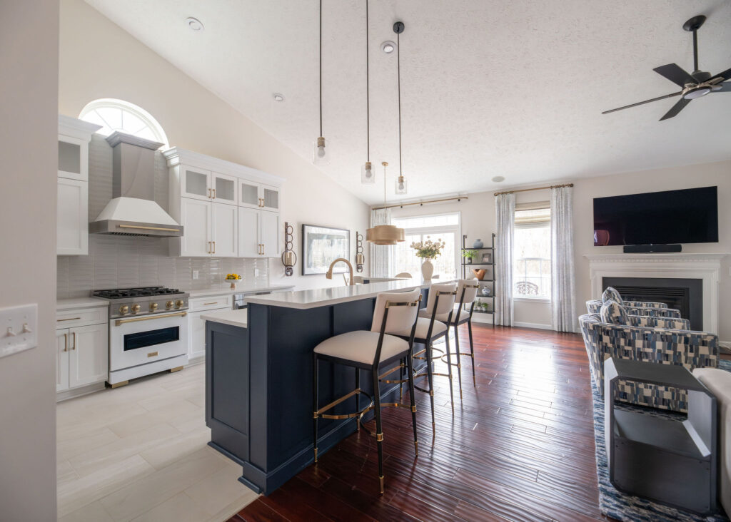 Kitchen and living room in Penninsula Ohio with open concept and lots of indigo color. Lindsey Putzier interior design 