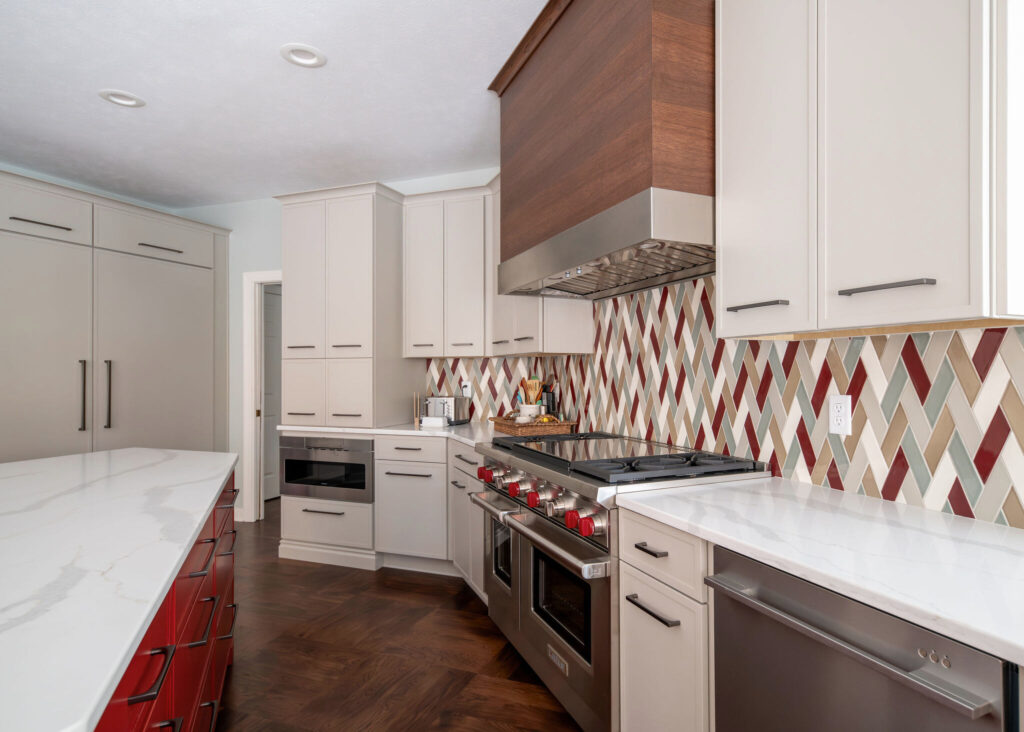 After of kitchen with remodeled backsplash with colorful mosaic tiles and sleek cabinets. Lindsey Putzier interior design Chagrin Falls, Ohio 