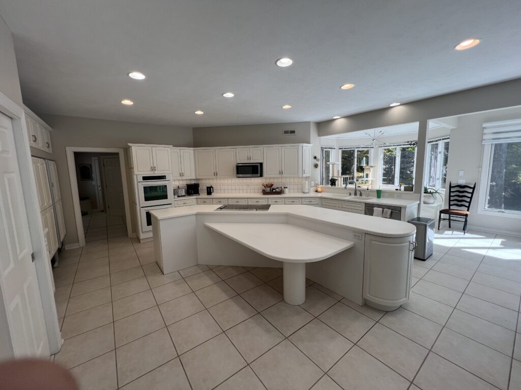 Before of kitchen in Chagrin Falls with dates cream island and cabinets. Lindsey Putzier interior design 