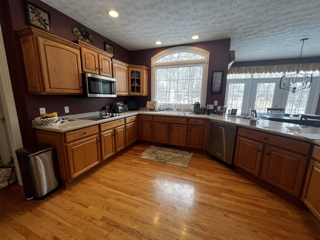 Before of the peninsula in this Aurora Ohio kitchen with a unnatural layout. Lindsey Putzier interior design 