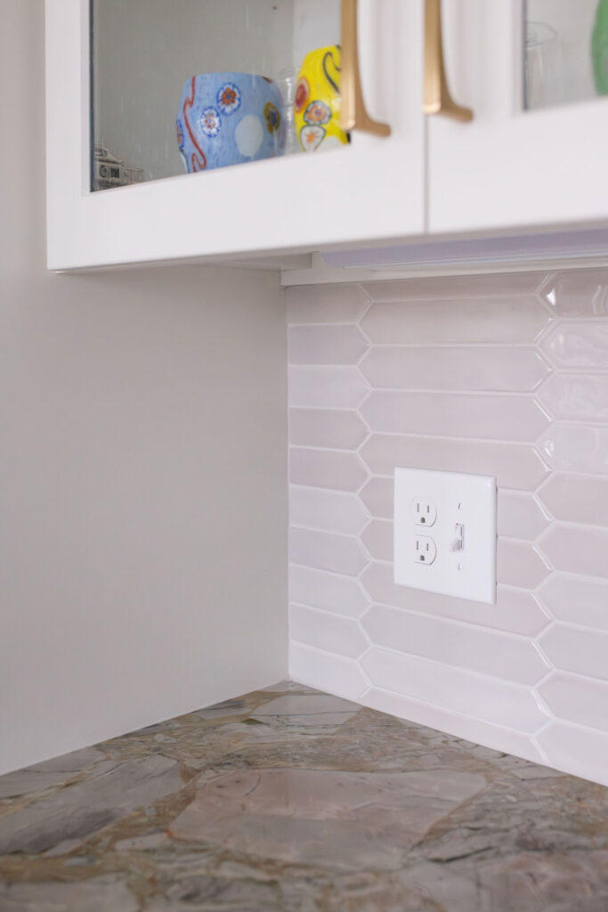 White tile backsplash in the kitchen of Aurora Ohio home remodel. Lindsey Putzier Interior design 