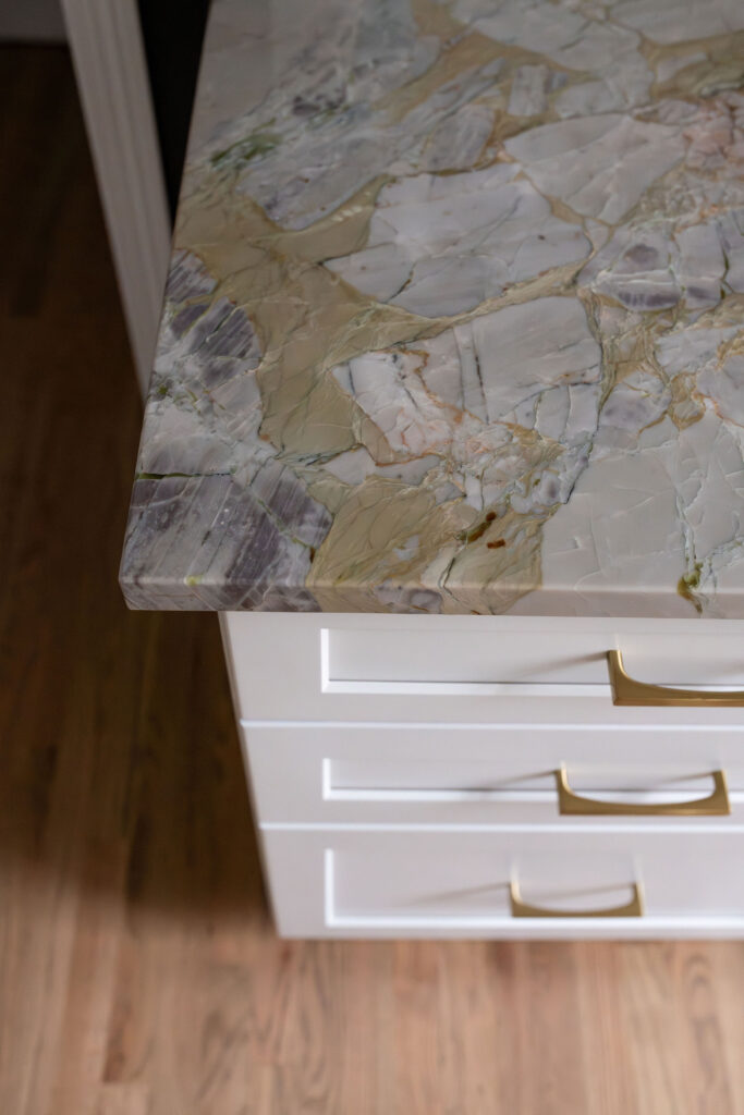 Granite countertops that inspired the rest of the kitchen with earth tones in them. Lindsey Putzier interior design Aurora Ohio