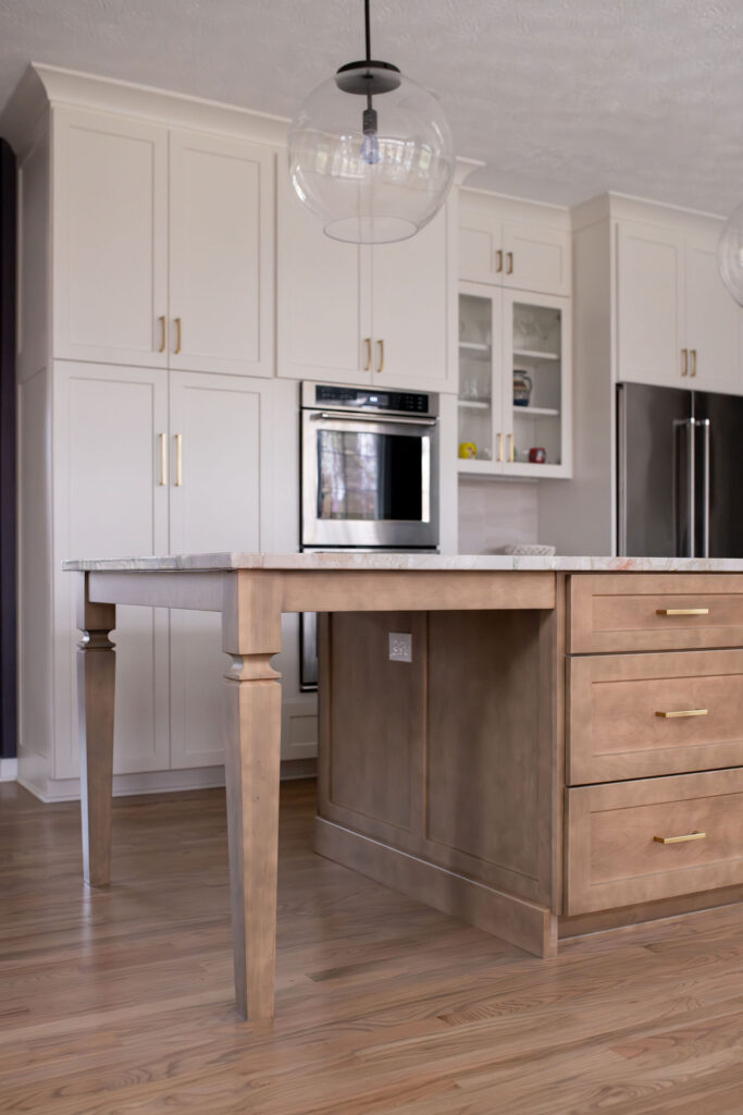 Island with built in seating in Aurora kitchen remodel. Lindsey Putzier interior design 