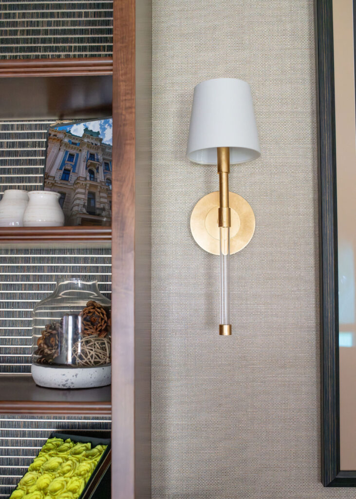 Golden sconce lighting in the home office on textured wallpaper. Lindsey Putzier interior design Copley Ohio 