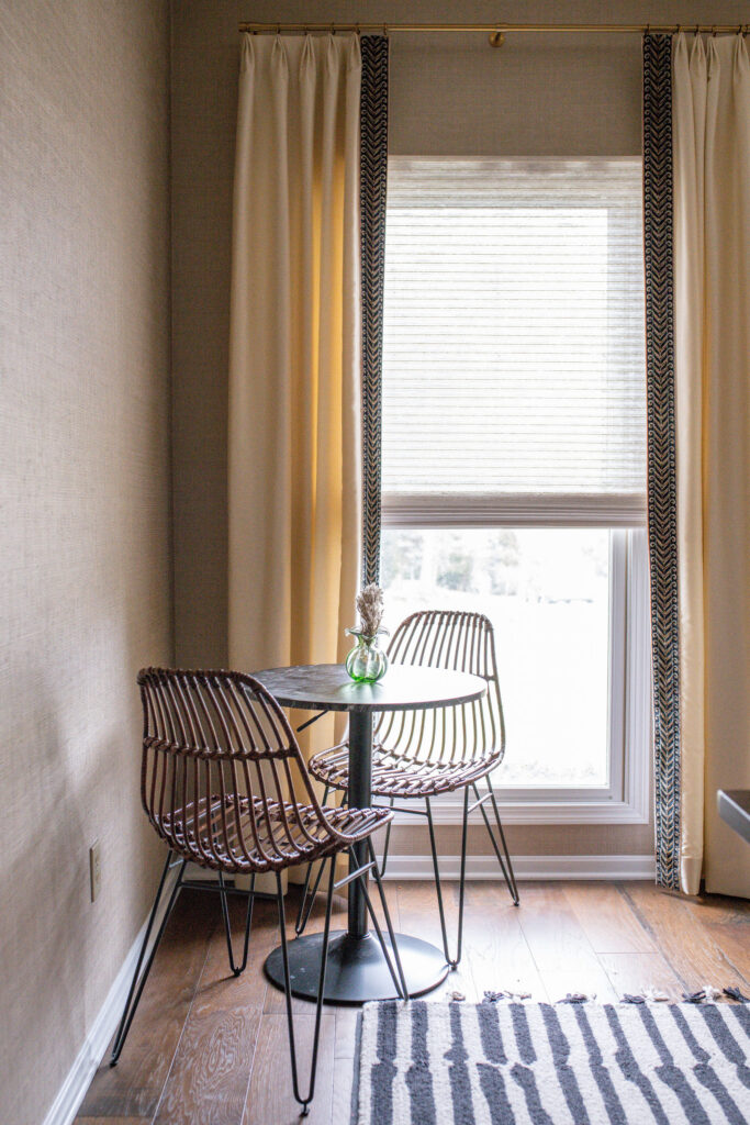 Cafe table and chairs in the home office with custom window treatments. Lindsey Putzier interior design Copley Ohio 