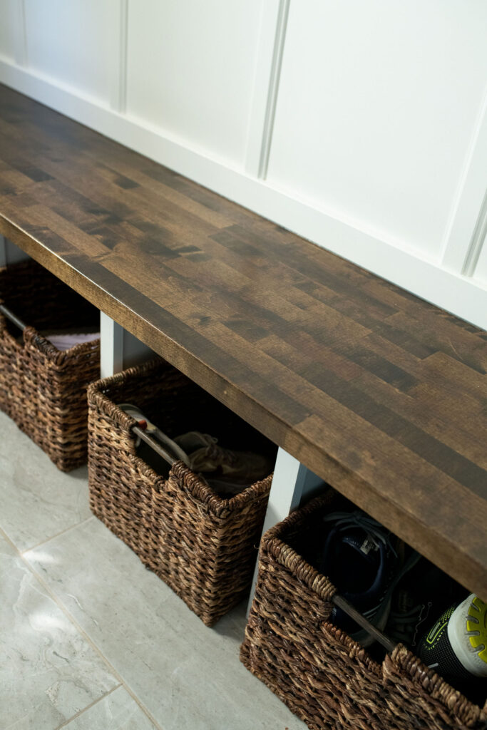 baskets to organize shoes and clutter in the mudroom. Lindsey Putzier interior design
