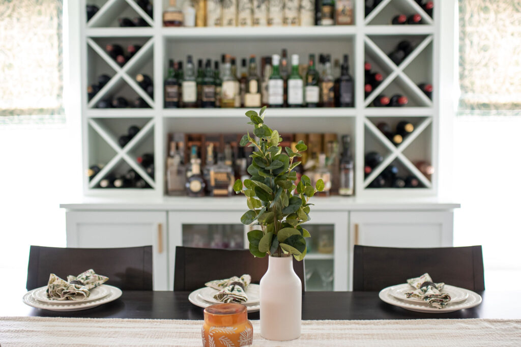 Decorative plant in front of the bar. Lindsey Putzier interior design 