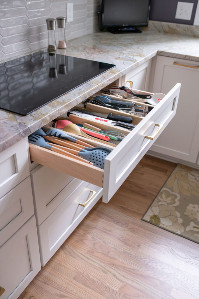 custom utensil drawer next to the stove in the kitchen. Lindsey Putzier interior design
