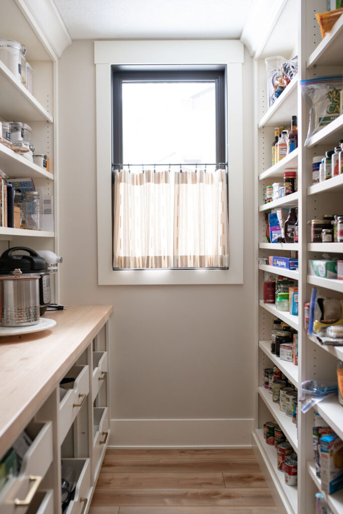 Open shelving in the butlers pantry to organize and display. Lindsey Putzier interior design