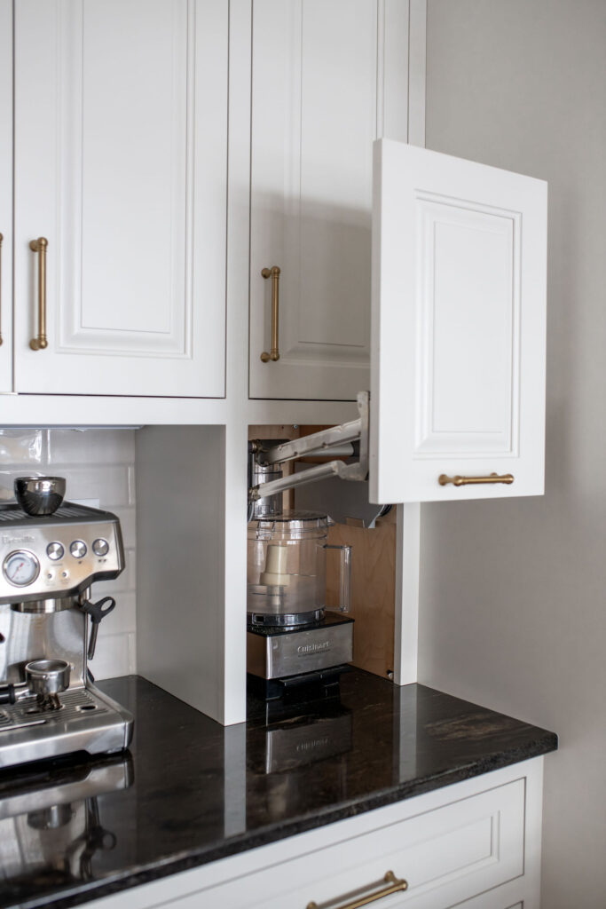 Custom appliance garage in the kitchen to conceal blender and small appliances. Lindsey Putzier interior design