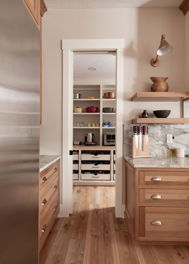 Open walk through entry to the butlers pantry. Lindsey Putzier interior design 