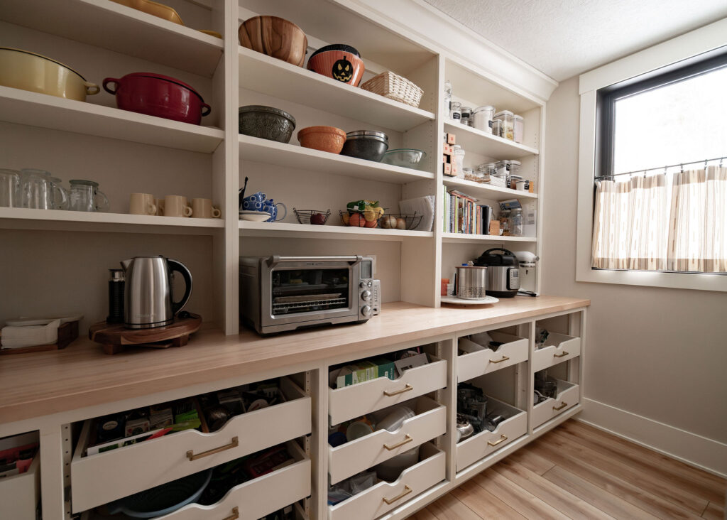 Butlers pantry with open shelving and pull out drawers for organization. Lindsey Putzier interior design 