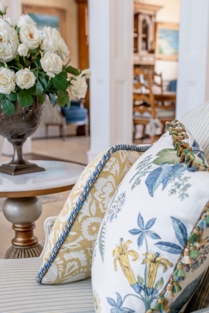 Custom pillows in the living room with colorful trim and tassels. Aurora Ohio Interior design Lindsey Putzier 