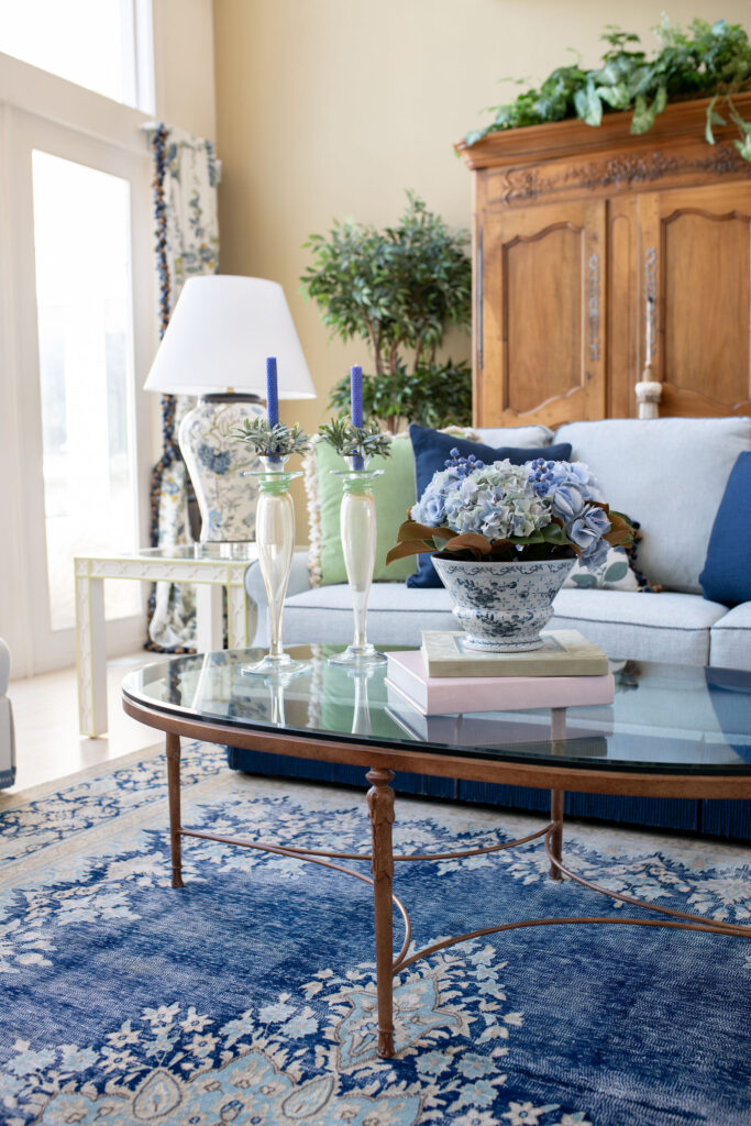 Living room in Aurora Ohio with french inspired design, custom furniture, window treatments, and design elements. Lindsey Putzier interior design 