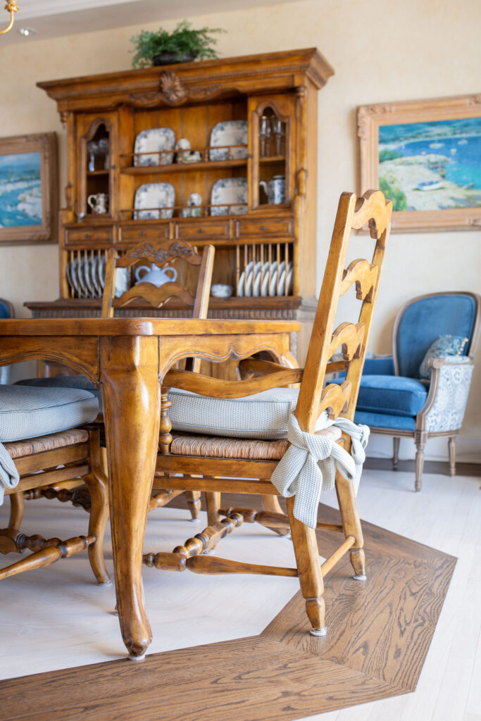 After of the dining room chair with new blue cushion with ties. Lindsey Putzier interior design Aurora Ohio 