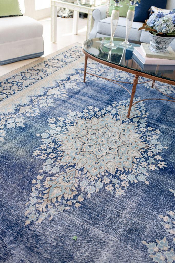 Vintage blue french rug in the living room. Aurora Ohio Interior design Lindsey Putzier 