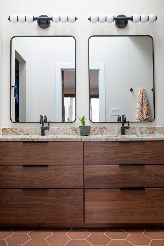 Master bathroom remodel with earthy stone countertops. Akron Ohio interior design Lindsey Putzier 