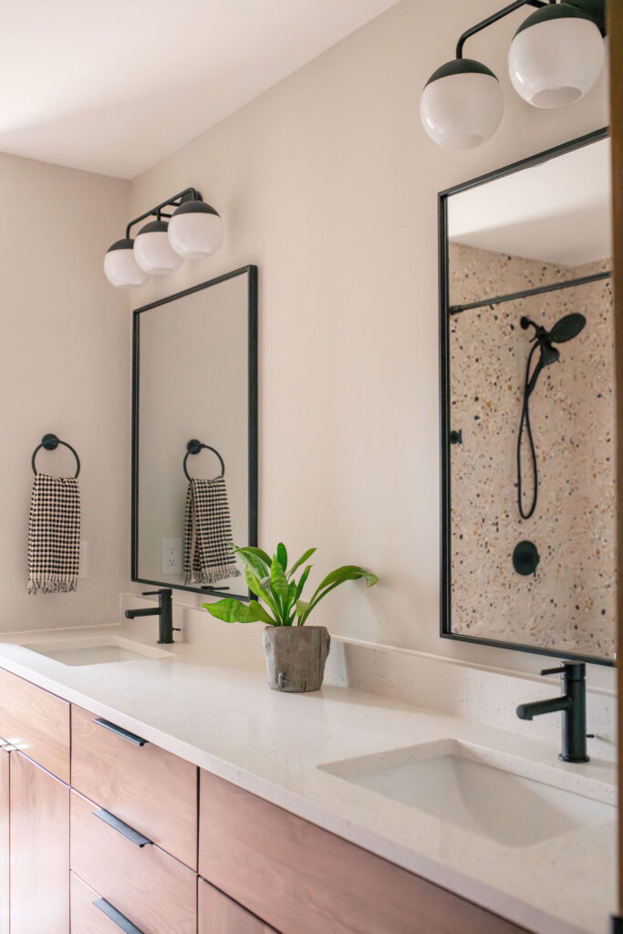 After of the secondary bathroom with updated countertops, cabinetry, and fixtures. Lindsey Putzier interior design Akron Ohio 