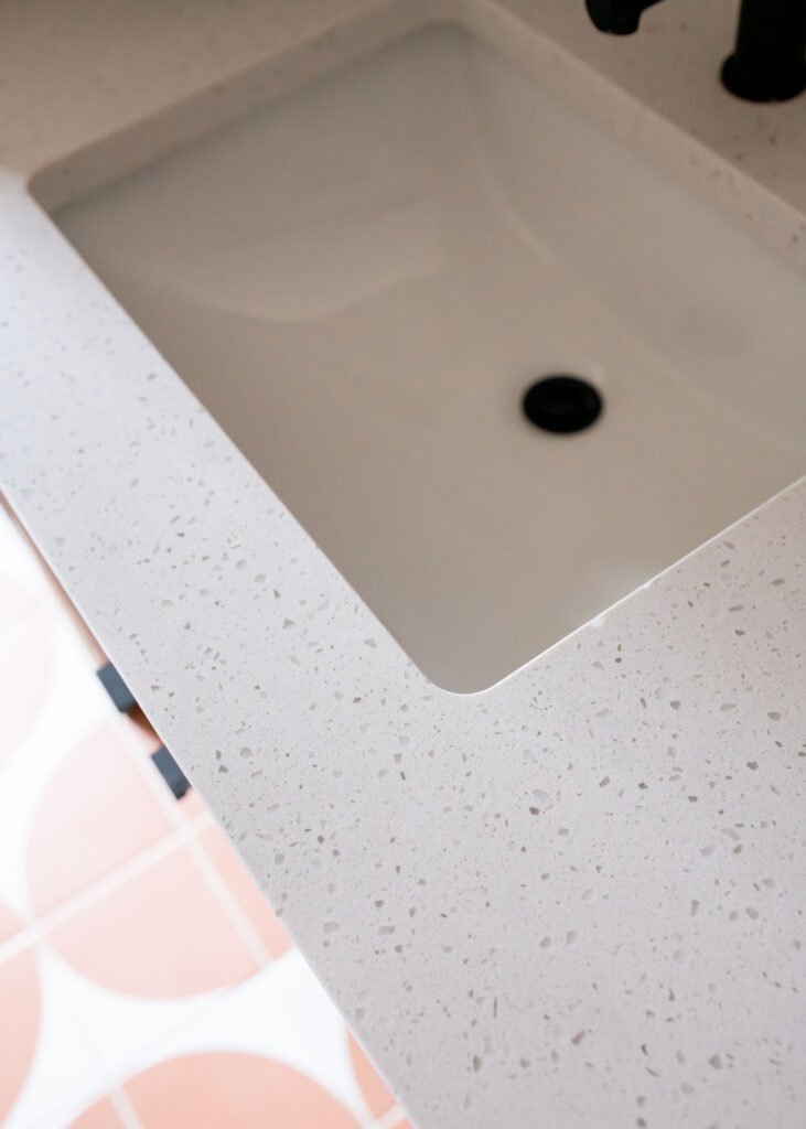 Stone countertops in the secondary bathroom. Akron Ohio interior design Lindsey Putzier 
