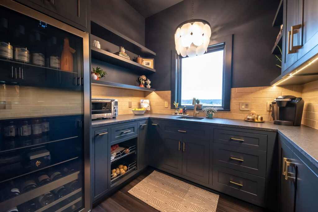 Butler's pantry bar with large wine fridge and deep cabinets and countertops. Lindsey Putzier interior design 