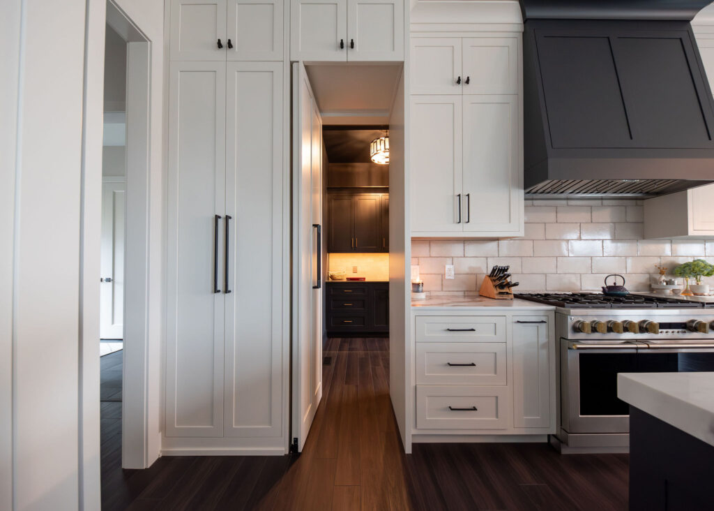 Hidden cabinet doors into the butlers pantry. Lindsey Putzier interior design 