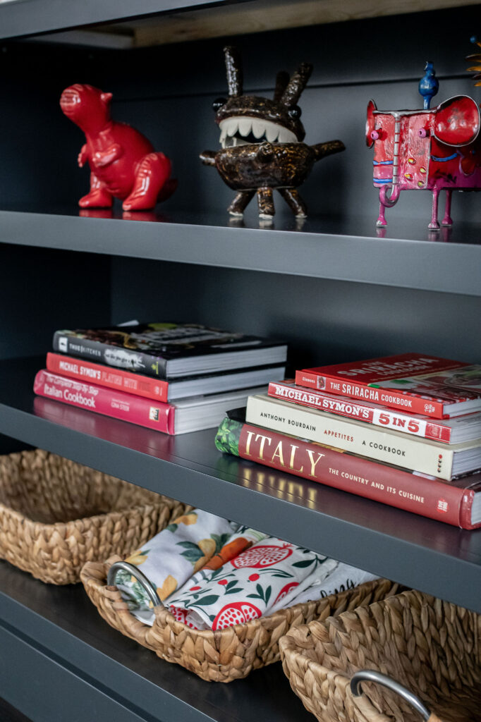 Open shelving in the kitchen to display design elements. Lindsey Putzier interior Design