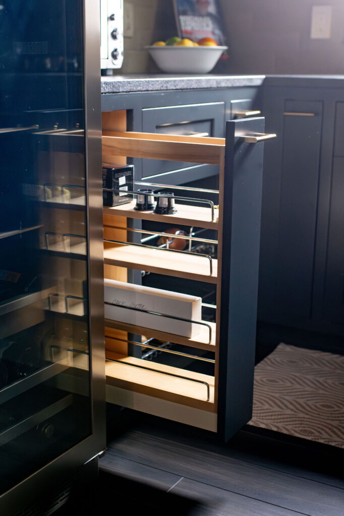 Pullout in the kitchen for additional tucked away storage. Lindsey Putzier interior design