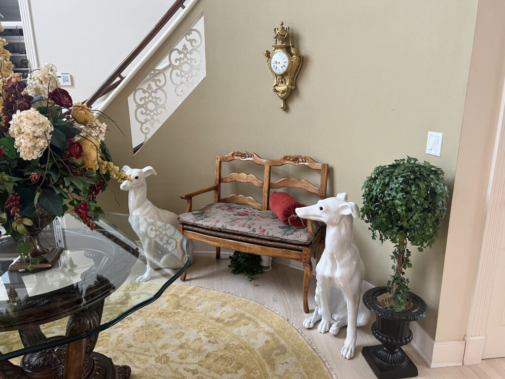 Before of the foyer bench in Aurora, Ohio with dates cushion and red pillow. Lindsey Putzier interior design 