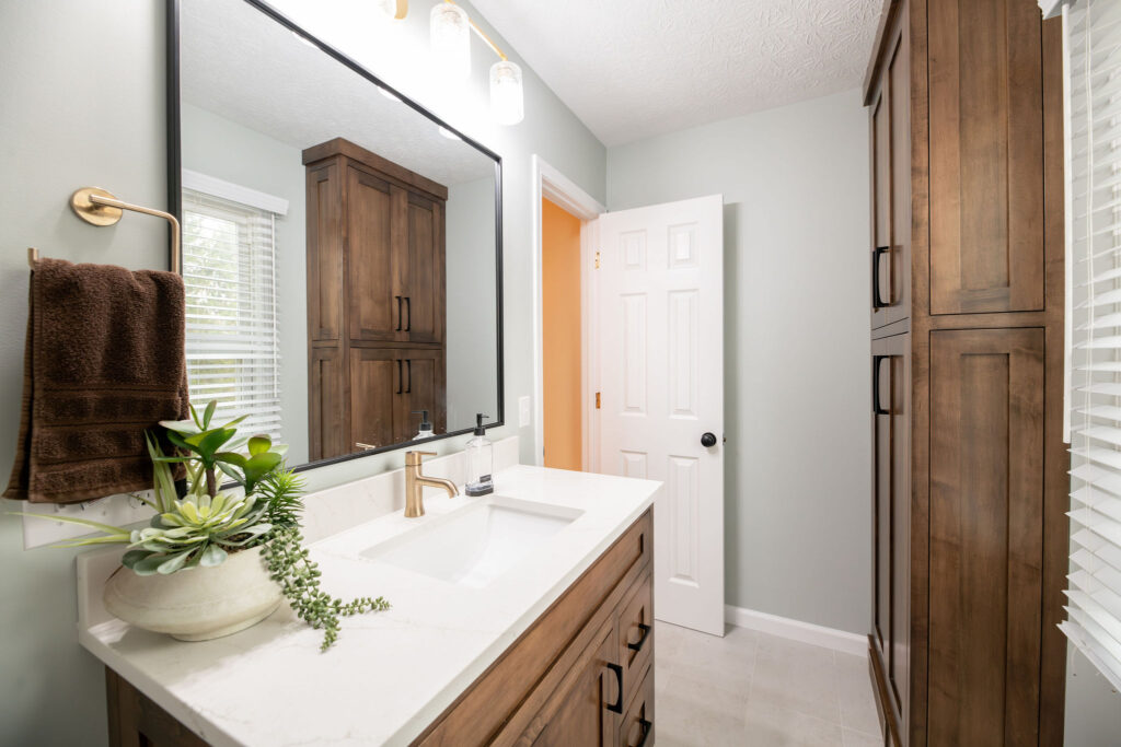 After of the bathroom with updated vanity, new paint and flooring. Lindsey Putzier interior design Hudson Ohio. 