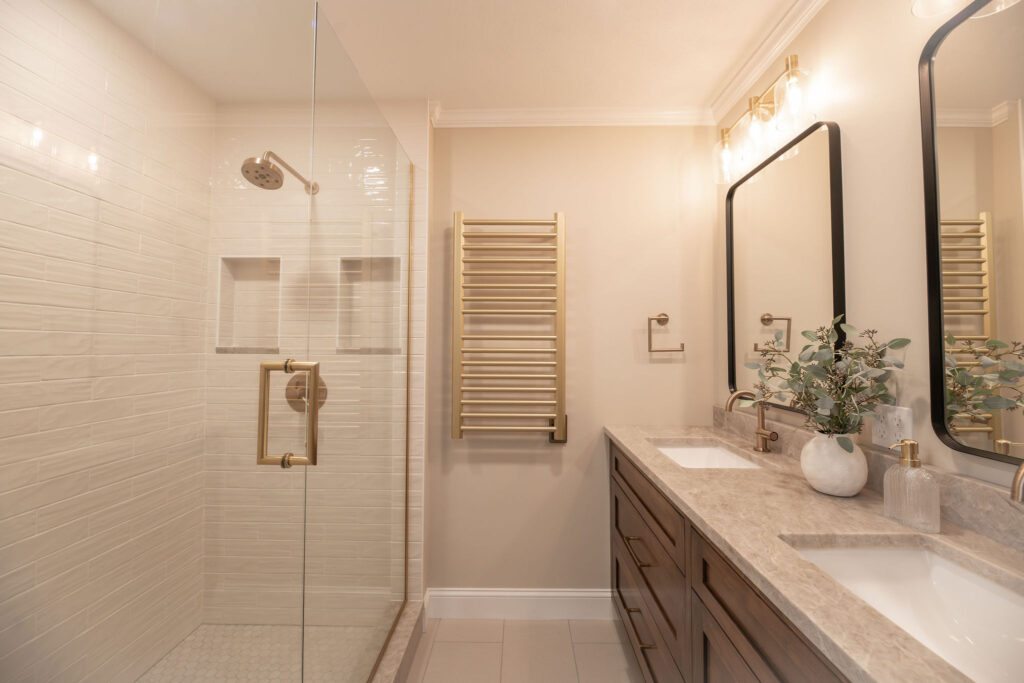 After of the master bathroom in Hudson Ohio with a new layout, updated cabinetry, countertops, and shower. Lindsey Putzier interior design 