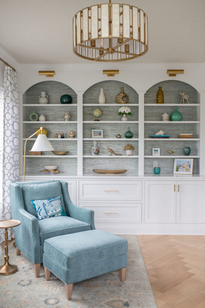 Home office with large wall of built ins for storage and styling. Lindsey Putzier interior design Hudson Ohio 