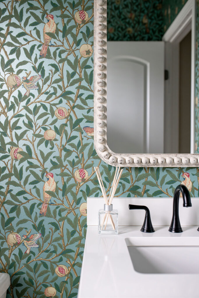 Silver rounded rectangle mirror in the powder room. Lindsey Putzier interior design Hudson Ohio 