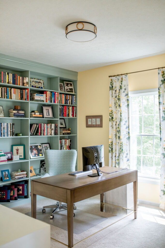 large wall of built in shelving to display books and other design accents. Lindsey Putzier interior design Hudson Ohio