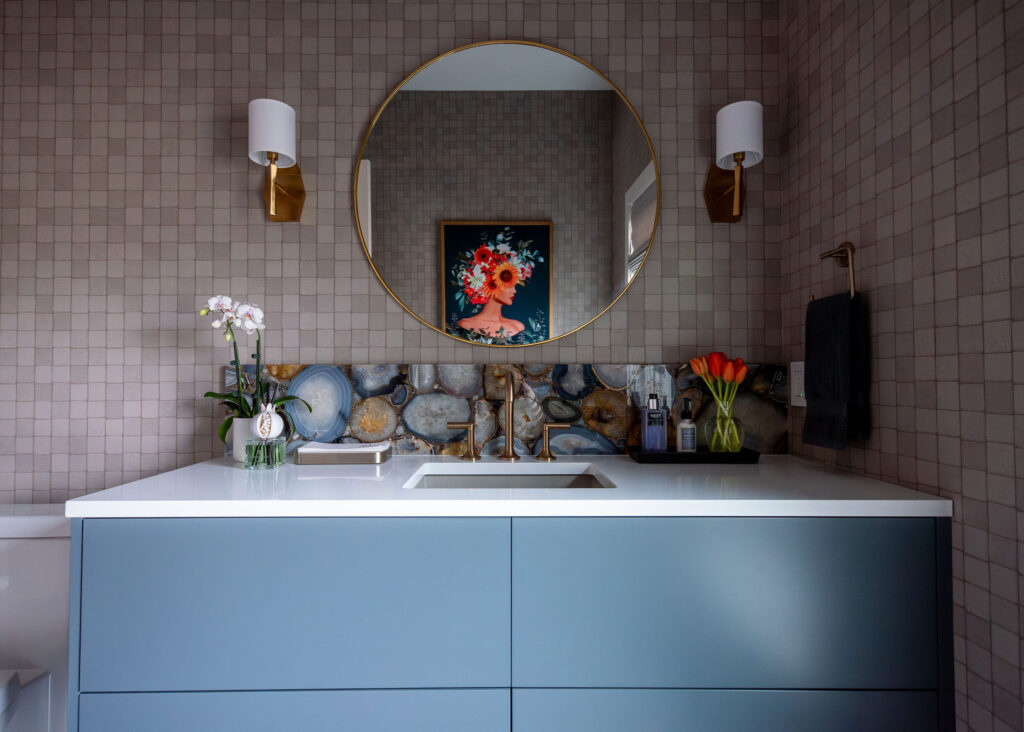 Powder room with painted floating vanity and tiled wall. Lindsey Putzier interior design Hudson Ohio 