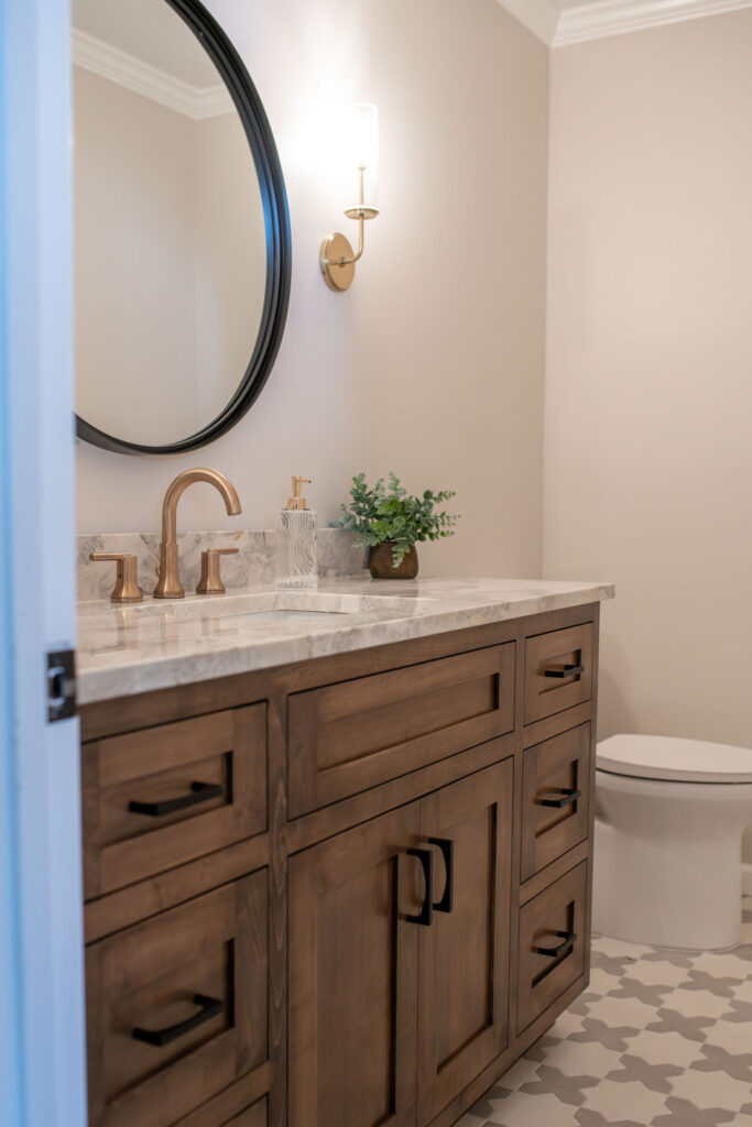 After of the powder room with new paint, flooring, vanity & countertops. Lindsey Putzier interior design Hudson Ohio 