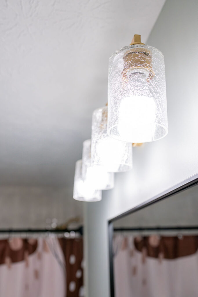 Updated lighting fixtures in the kids bathroom. Hudson Ohio interior design Lindsey Putzier 