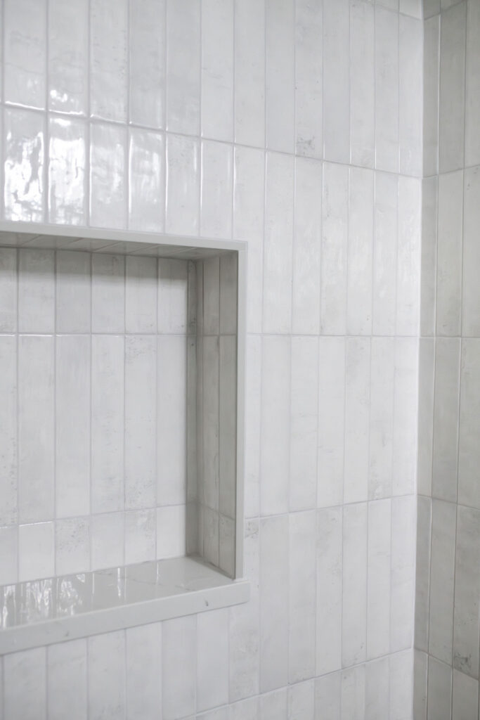 Kids bathroom with clean white tile shower. Lindsey Putzier interior design Hudson Ohio 