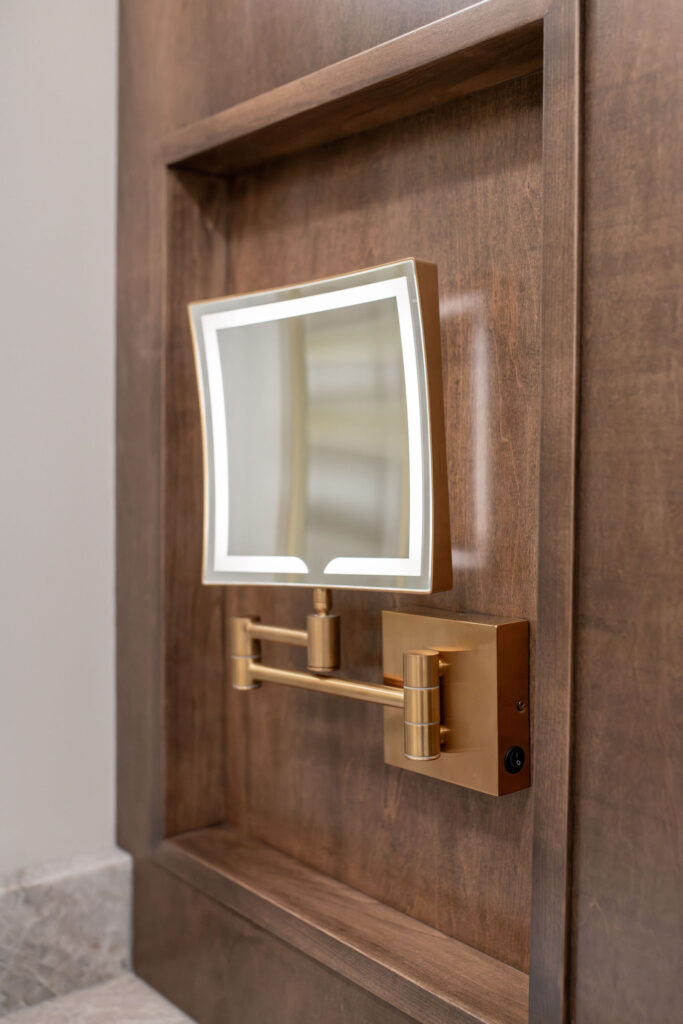 Built in custom cosmetic mirror in the master bathroom. Lindsey Putzier interior design Hudson Ohio 