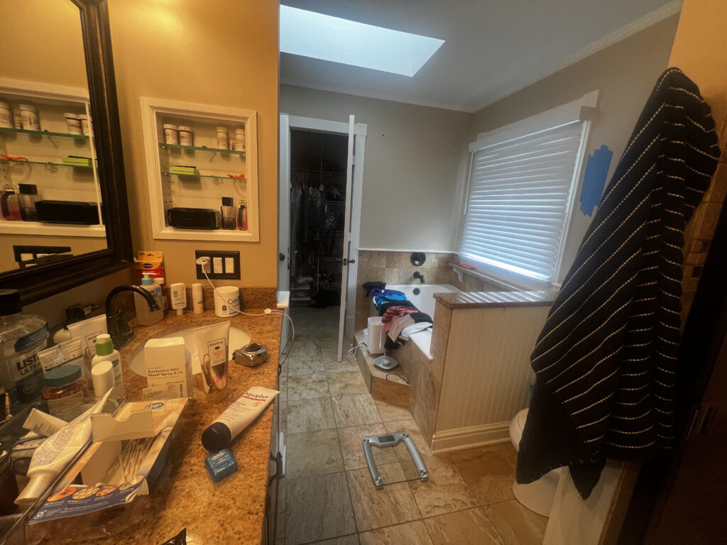 Before of the master bathroom with large soaking tub and awkward layout. Hudson Ohio interior design Lindsey Putzier 