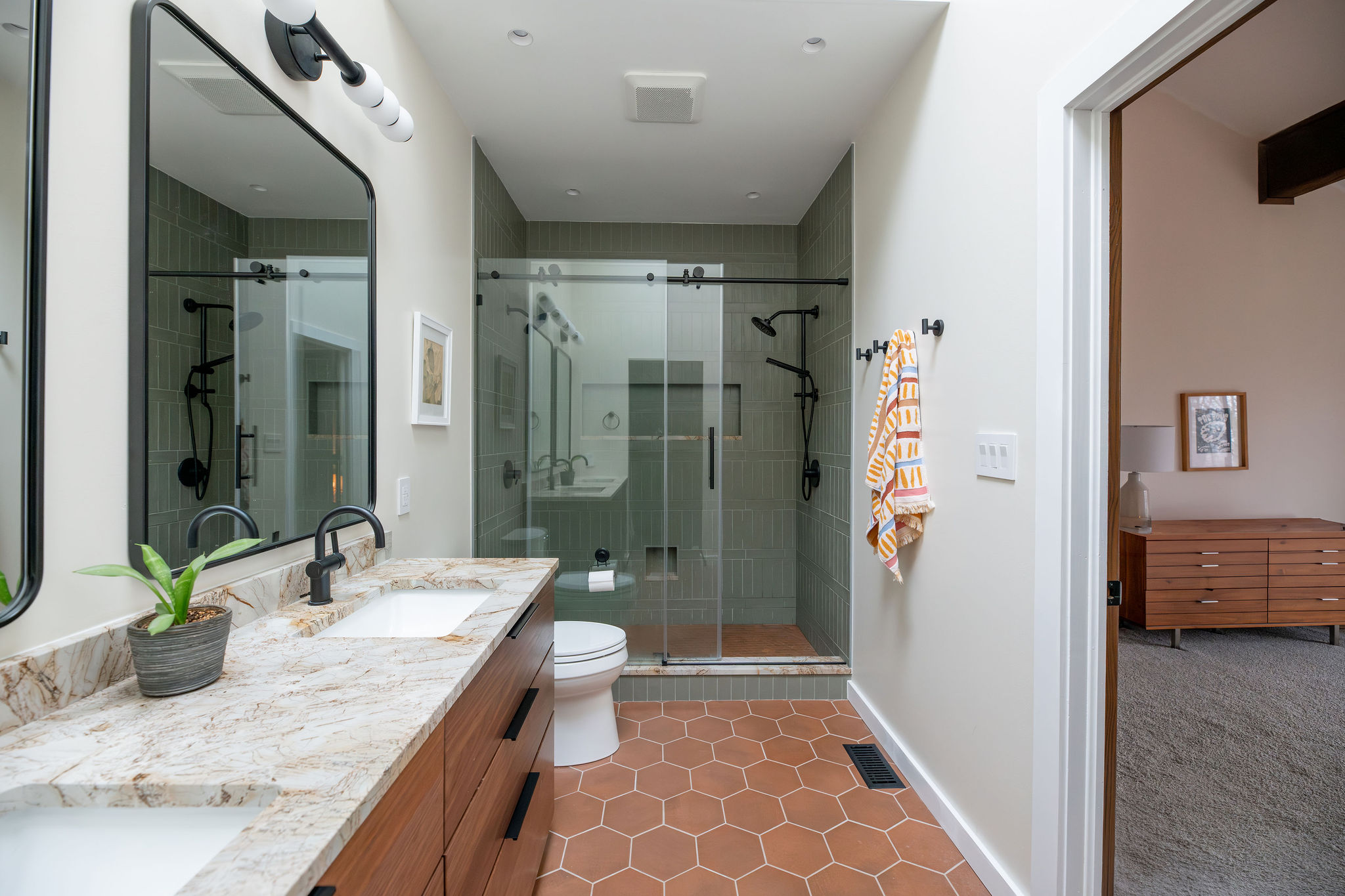 Earthy Oasis: A Dual Bathroom Transformation