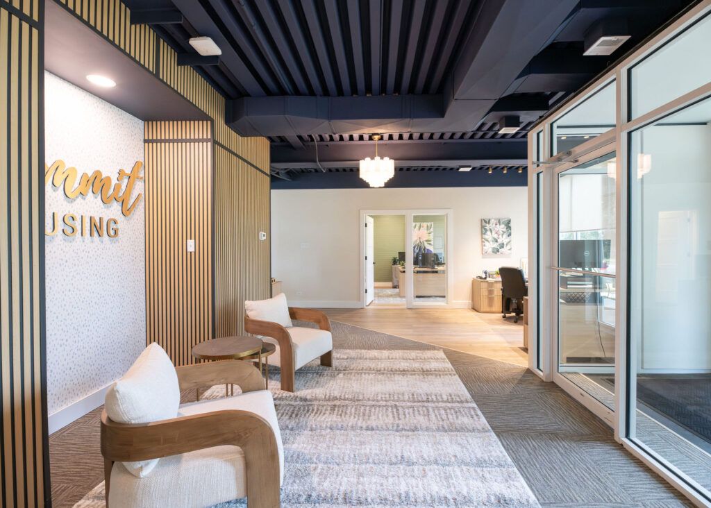 After of the main lobby area with new lighting fixtures, carpet ad updated furniture. Cuyahoga Falls Ohio. Lindsey Putzier interior design