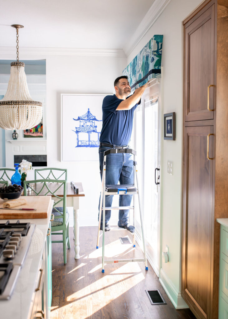 Nathan Putzier of Premier Transformations installing items Hudson Ohio interior design Lindsey Putzier 