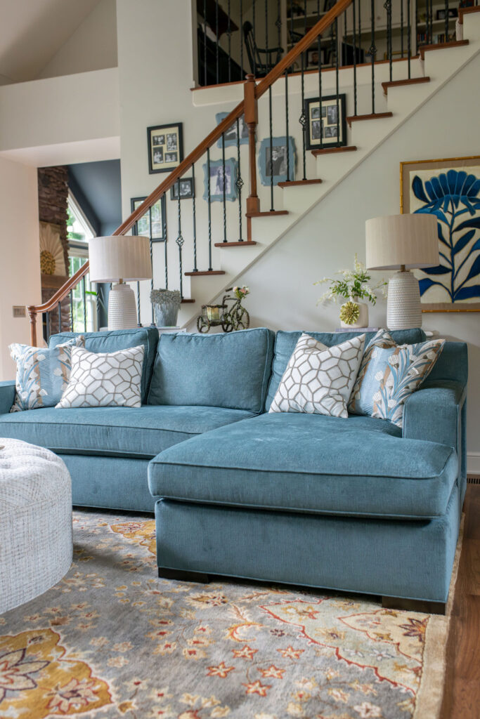 Blue performance fabric sofa in the living room. Lindsey Putzier Interior Design Aurora Ohio 