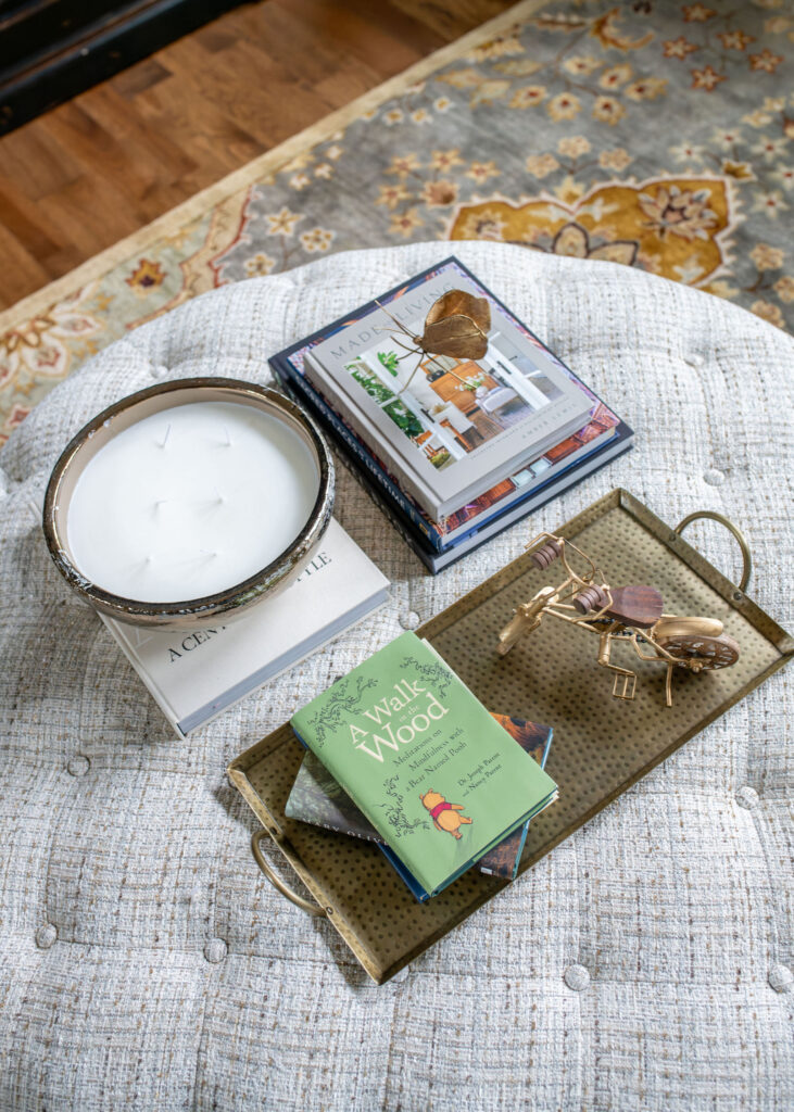 Ottoman in the living room with performance fabric, and vintage inspired rug. Lindsey Putzier Interior Design Aurora Ohio  
