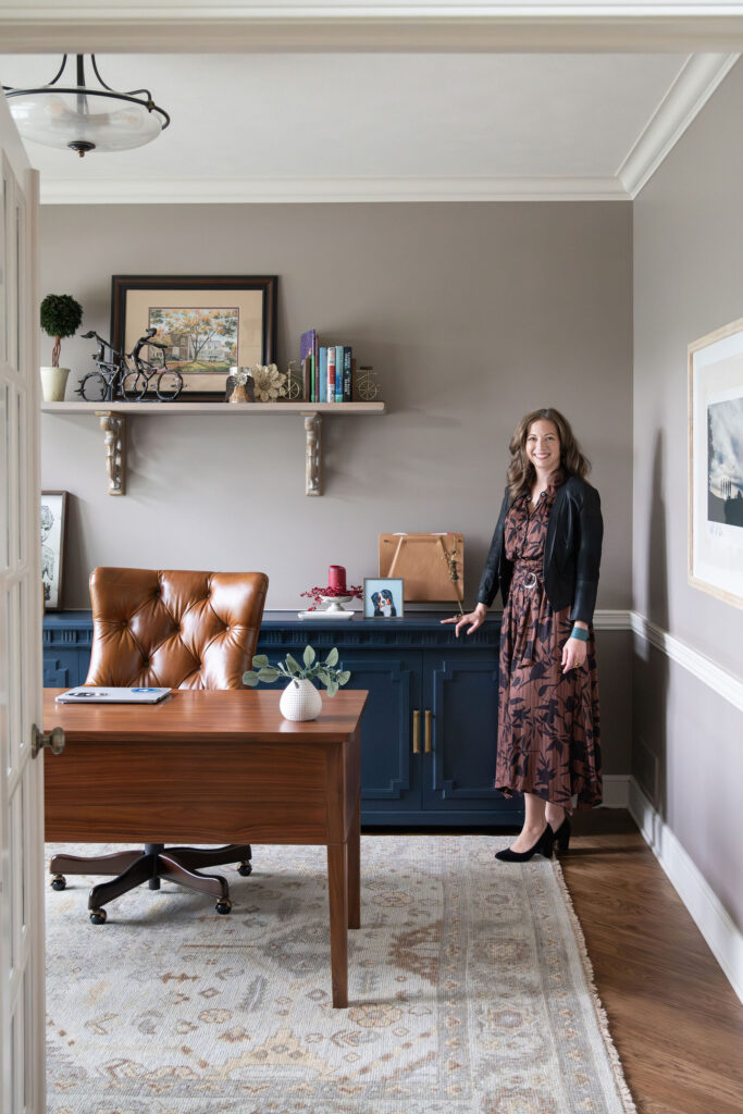 Lindsey Putzier, founder & principal designer, standing in the updated home office in Aurora, Oh home 