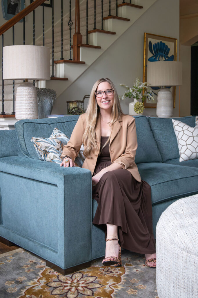 Julianna Watts, Senior designer, in living room.  Lindsey Putzier Interior Design Aurora Ohio 