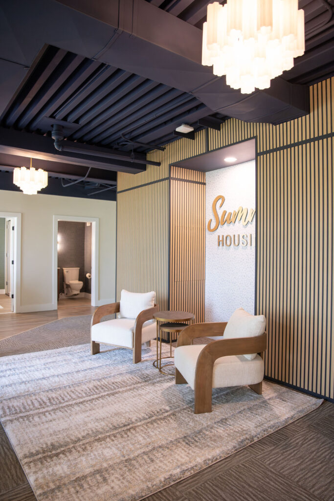 Main lobby in new office building with millwork and seating area. Cuyahoga Falls Ohio. Lindsey Putzier interior design