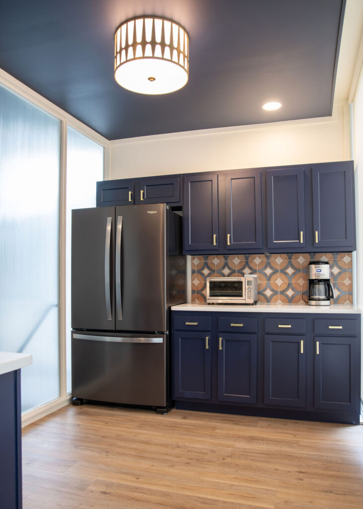After of the breakroom with updated backsplash, appliances, and sink. Cuyahoga Falls Ohio. Lindsey Putzier interior design