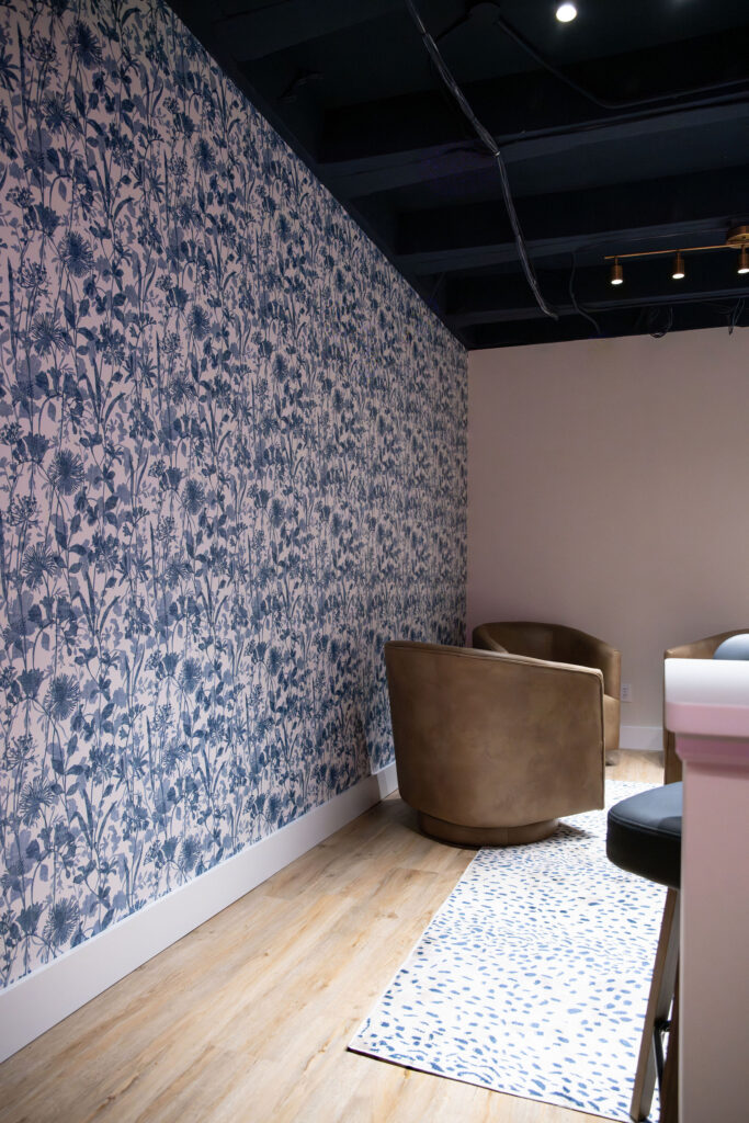 wallpapered wall in the basement of the office. Cuyahoga Falls Ohio. Lindsey Putzier interior design