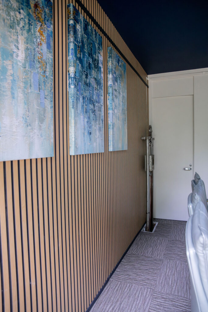 New millwork and artwork in the conference room. Cuyahoga Falls Ohio. Lindsey Putzier interior design